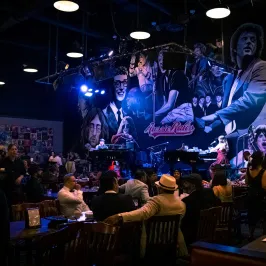 Buddy Holly et al. on a stage in front of a crowd