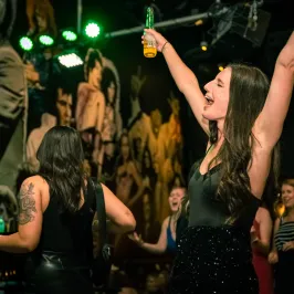 a group of people standing on a stage in front of a crowd