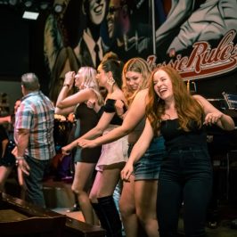 a group of people sitting on a stage